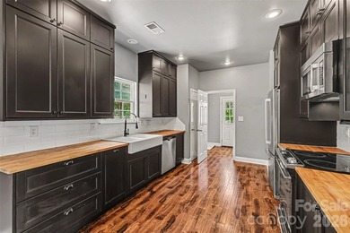 Nestled on a beautifully maintained lot in one of Belmont's most - photo 14