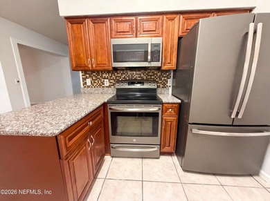 A one-story Jacksonville home on a cul-de-sac, featuring four - photo 3