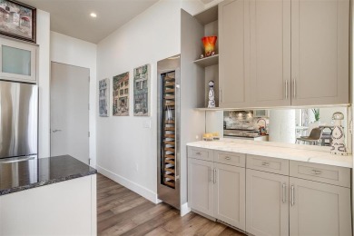 Experience luxury in this premier, downtown-facing condo at the