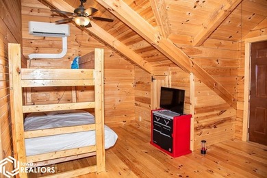 Rustic charm meets everyday convenience in this Amish-built log - photo 19