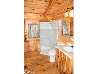 Rustic charm meets everyday convenience in this Amish-built log - photo 25