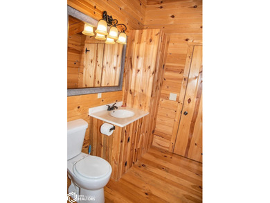 Rustic charm meets everyday convenience in this Amish-built log - photo 26