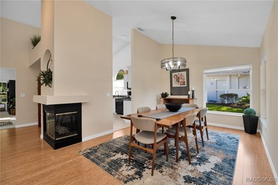 Enter to vaulted ceilings, beautiful bamboo floors in living and - photo 8