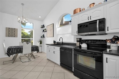 Enter to vaulted ceilings, beautiful bamboo floors in living and - photo 10