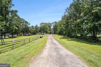 Lake Home For Sale in Ellenwood, Georgia
