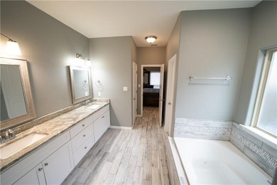 Exquisite 4 bedroom, 3 bath home with a 2 car garage, featuring - photo 24