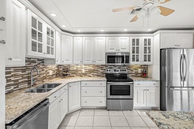 Spacious 3-bedroom, 2-bath condo featuring wood-look tile - photo 2