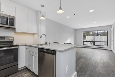 Tastefully remodeled first floor unit with a unique