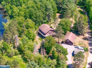 Nestled on 28 private acres with 805 feet of lake frontage and - photo 1