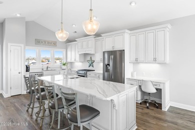 Beach access directly across the street sets the tone for this