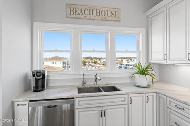 Beach access directly across the street sets the tone for this