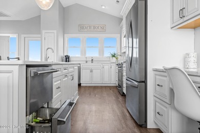 Beach access directly across the street sets the tone for this