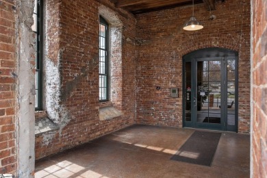 Experience historic charm and modern luxury in this beautifully