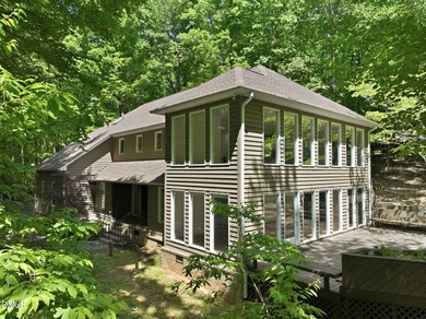 Tucked away on 5 private wooded acres with a peaceful pond, this - photo 4