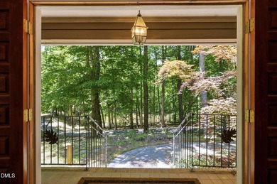 Tucked away on 5 private wooded acres with a peaceful pond, this - photo 8