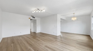 Beautiful corner unit featuring 2 bedrooms and 2 bathrooms with - photo 3