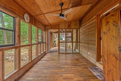 Nestled on 5 private wooded acres, this custom log home offers - photo 13