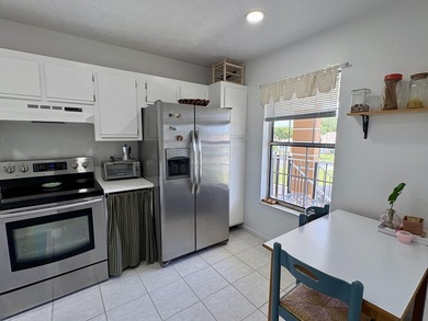 Beautifully updated 2-bedroom, 2-bath second-floor condo located - photo 4