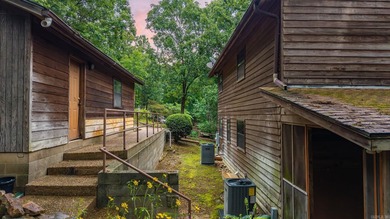 Nestled on 5 private wooded acres, this custom log home offers - photo 41