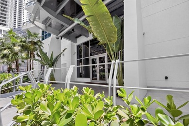 This 2/2 condo is in a vibrant area of the city and within - photo 4