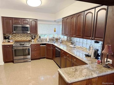 Welcome to 1475 Avondale, a spacious ranch home ideally located - photo 3