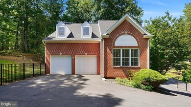 Beautifully updated custom built three level home in an amenity - photo 1