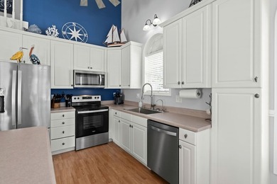 This spacious 3 Bedroom 2.5 Bath raised 1.5 story beach house is - photo 13