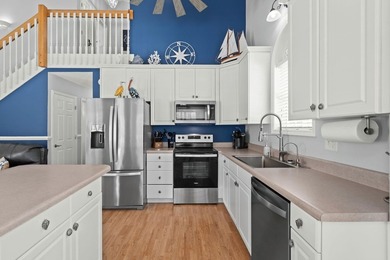 This spacious 3 Bedroom 2.5 Bath raised 1.5 story beach house is - photo 14