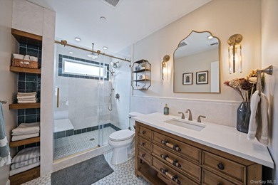 Just over one block from the beach, this fully renovated home - photo 15