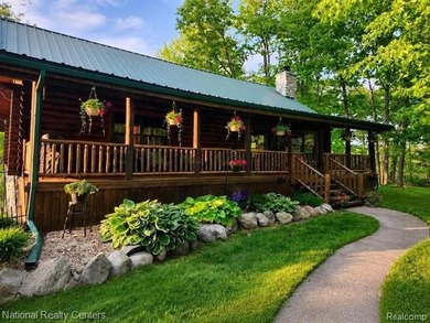 Welcome to this meticulously maintained 2,400 sq. ft. log home - photo 1
