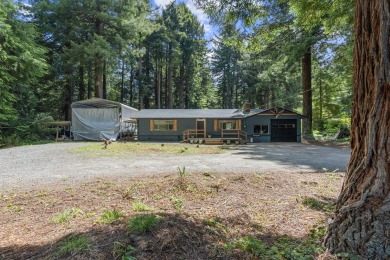 Tucked beneath towering redwoods on a full acre, this 2-bedroom - photo 1