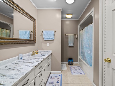 Welcome to 6101 Albatross Drive, located in the beautiful gated