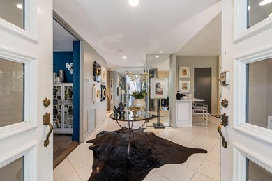 This stunning Hollywood Regency-inspired home inside the gates - photo 6