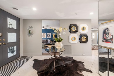 This stunning Hollywood Regency-inspired home inside the gates - photo 7