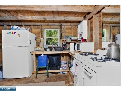 Escape to the Northwoods with this off grid seasonal cabin on 7 - photo 5