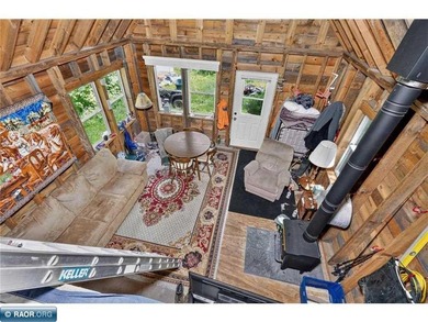 Escape to the Northwoods with this off grid seasonal cabin on 7 - photo 8