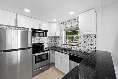 Spacious 1-bedroom, 1.5-bathroom condo conveniently located on - photo 1