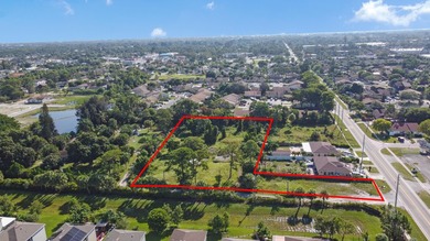 This prime 1.41-acre property in central Lake Worth offers two - photo 1