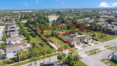 This prime 1.41-acre property in central Lake Worth offers two - photo 2