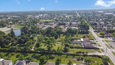 This prime 1.41-acre property in central Lake Worth offers two - photo 4