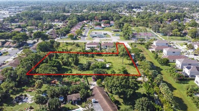 This prime 1.41-acre property in central Lake Worth offers two - photo 6