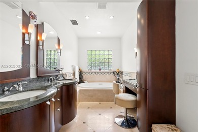 Located on prestigious South Hibiscus Drive, this exceptional - photo 23