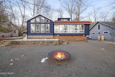 This stunning Lake Wallenpaupack lakefront property boasts level - Lake Home For Sale in Lake Ariel, Pennsylvania