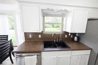 Step into this inviting 4 bedroom, 2 bath home tucked away on a - photo 11