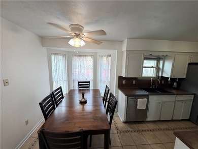 Step into this inviting 4 bedroom, 2 bath home tucked away on a - photo 12