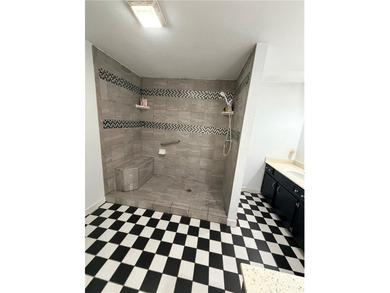 Step into this inviting 4 bedroom, 2 bath home tucked away on a - photo 18