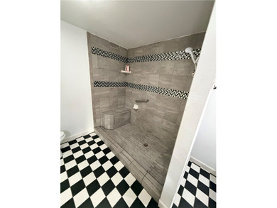 Step into this inviting 4 bedroom, 2 bath home tucked away on a - photo 19