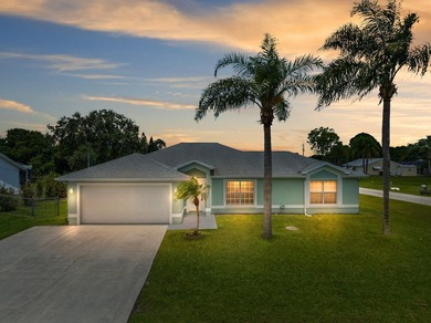 Welcome to 2297 SE Marsh Ave, a 3-bedroom, 2-bath home in a - photo 1
