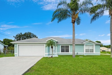 Welcome to 2297 SE Marsh Ave, a 3-bedroom, 2-bath home in a - photo 3
