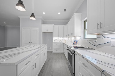 Beautiful new 3/2/2 home in secluded St. Andrews Place, nestled - photo 10